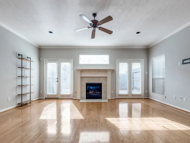 a view of a livingroom with a fireplace and window