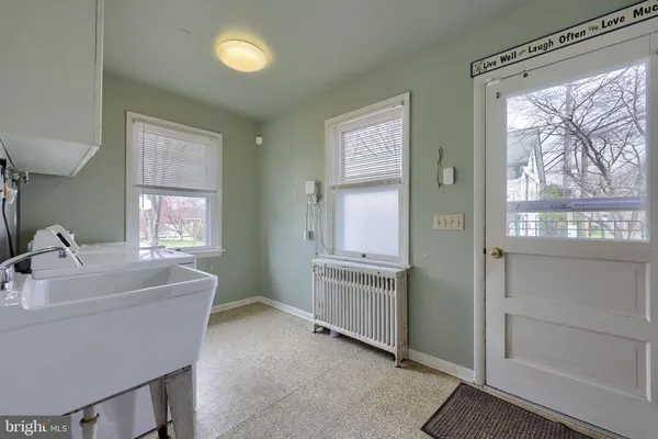 a kitchen with cabinets appliances and a window