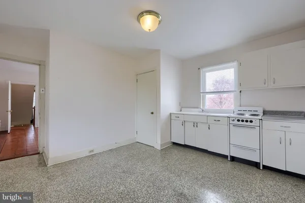 an aerial view of a house with a garden and swimming pool