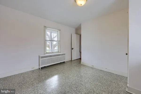 an aerial view of residential houses with outdoor space and swimming pool