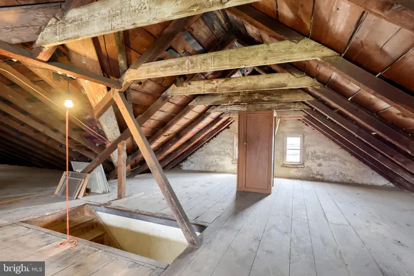 a view of a brick house with a yard
