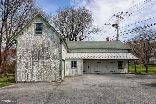 a view of a kitchen with furniture and windows
