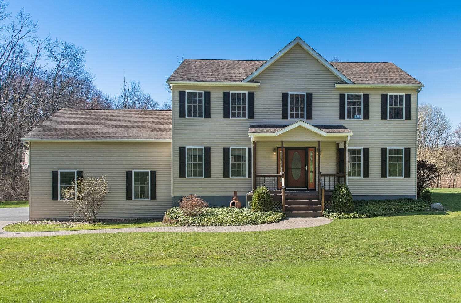 a front view of a house with a yard