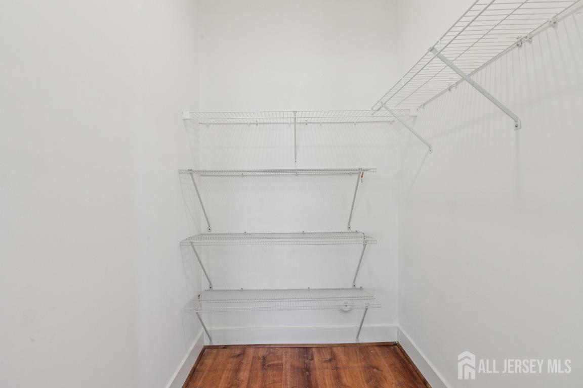 517 Tavern Road Monroe Township, NJ 08831 - Photo 24 of 27 a view of storage and utility room with empty racks