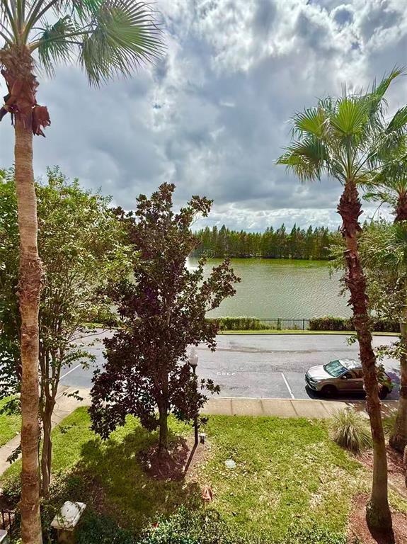 3751 Conroy Road, Unit 2334 Orlando, FL 32839 - Photo 11 of 20 a view of a lake with houses in the back