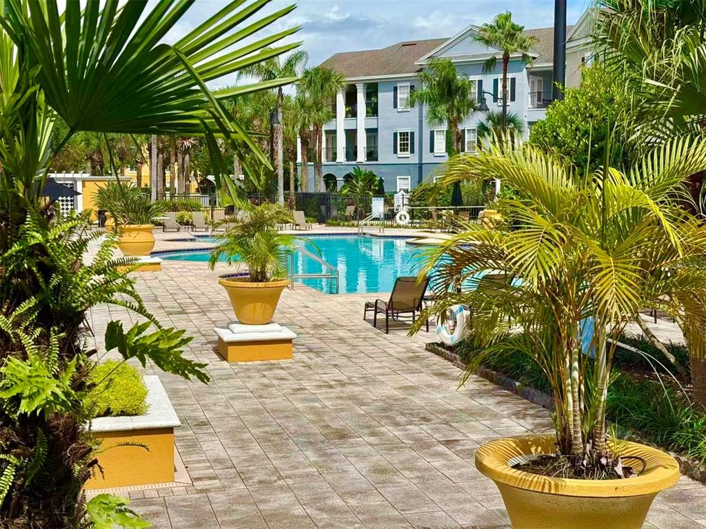 3751 Conroy Road, Unit 2334 Orlando, FL 32839 - Photo 14 of 20 a view of a swimming pool with a patio