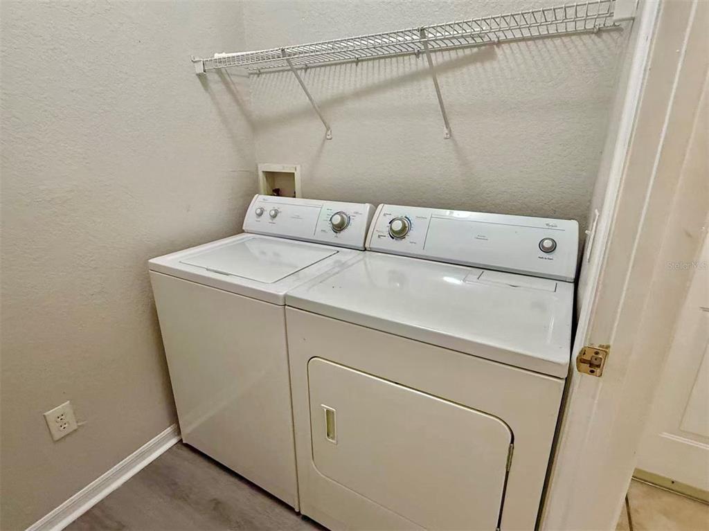 3751 Conroy Road, Unit 2334 Orlando, FL 32839 - Photo 8 of 20 a utility room with dryer and washer