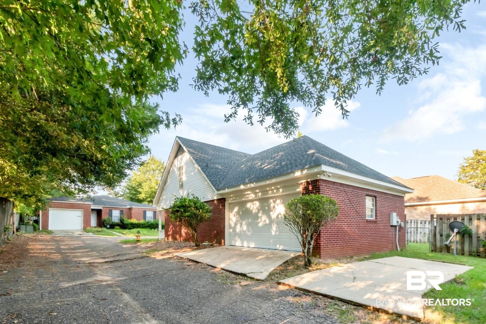 6482 Cedar Bend Court Mobile, AL 36608 - Photo 25 of 26 View of home's exterior with brick siding, roof with shingles, driveway, and a garage