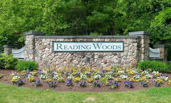 a street sign that is sitting in the grass