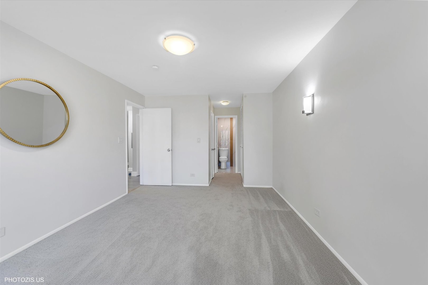 1126 South New Wilke Road, Unit 307 Arlington Heights, IL 60005 - Photo 15 of 37 a view of a room with wooden floor and a chandelier