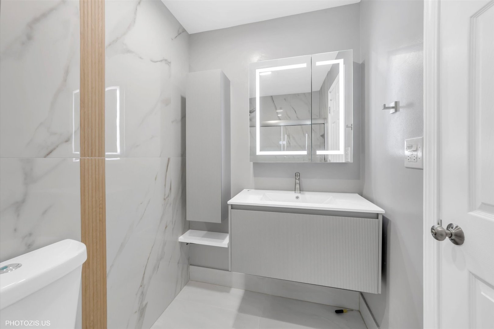 1126 South New Wilke Road, Unit 307 Arlington Heights, IL 60005 - Photo 17 of 37 a bathroom with a sink a toilet and shower