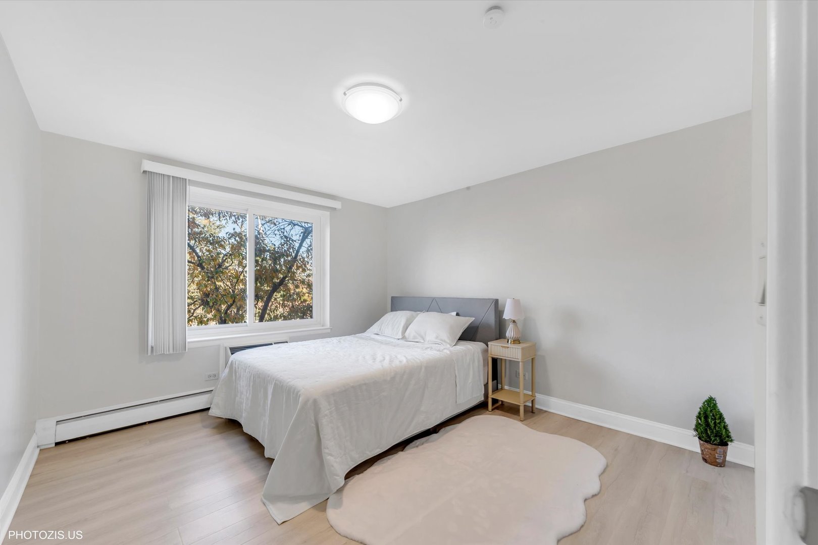 1126 South New Wilke Road, Unit 307 Arlington Heights, IL 60005 - Photo 19 of 37 a bedroom with a bed and a window