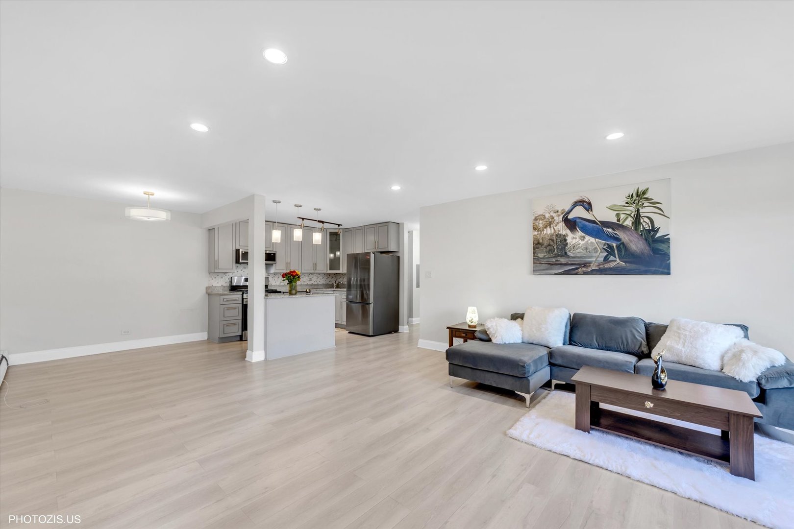 1126 South New Wilke Road, Unit 307 Arlington Heights, IL 60005 - Photo 5 of 37 a living room with furniture and kitchen view