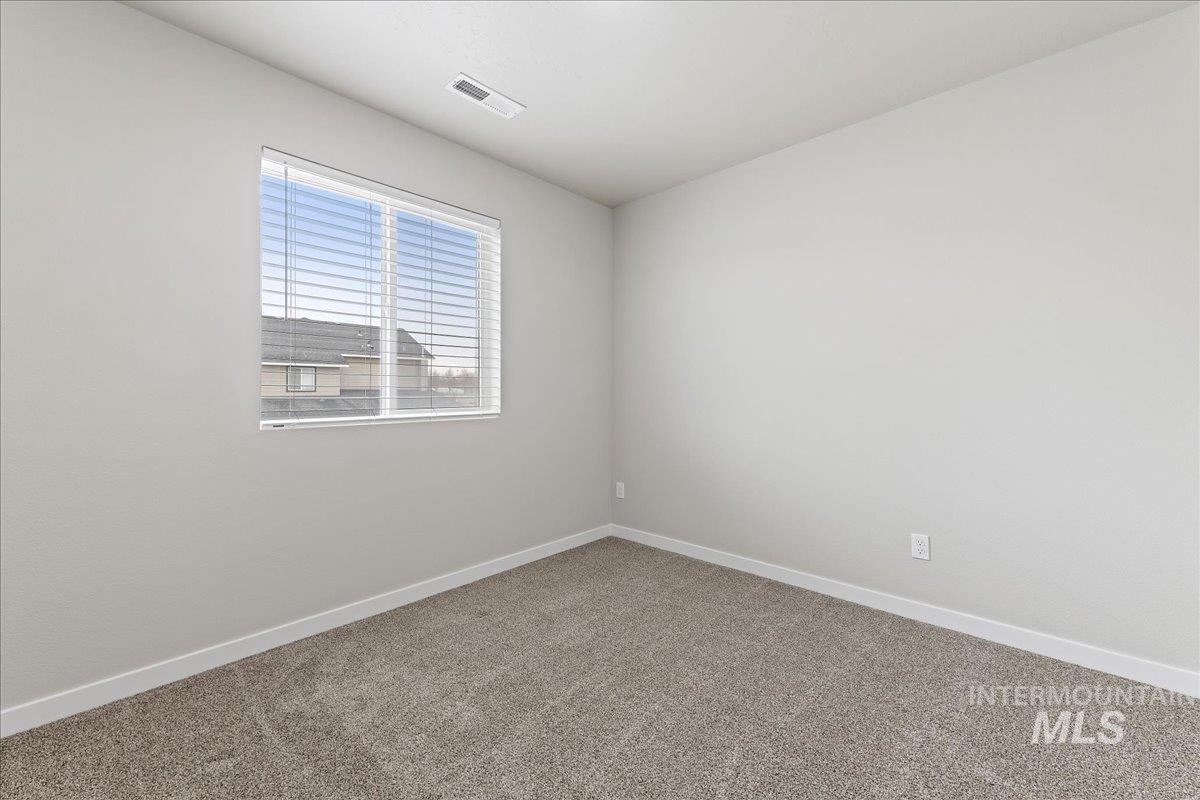 2479 East Goldstone Street Meridian, ID 83642 - Photo 17 of 29 Unfurnished room featuring baseboards and carpet flooring