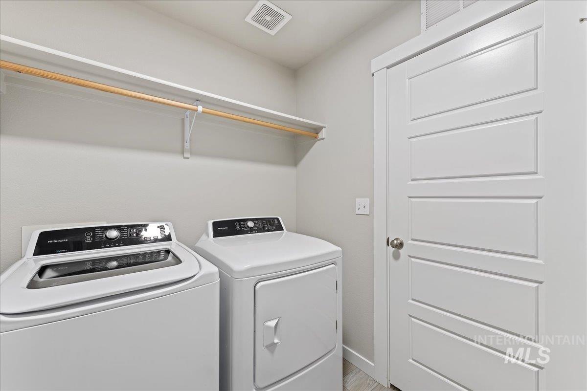 2479 East Goldstone Street Meridian, ID 83642 - Photo 24 of 29 Laundry area featuring separate washer and dryer