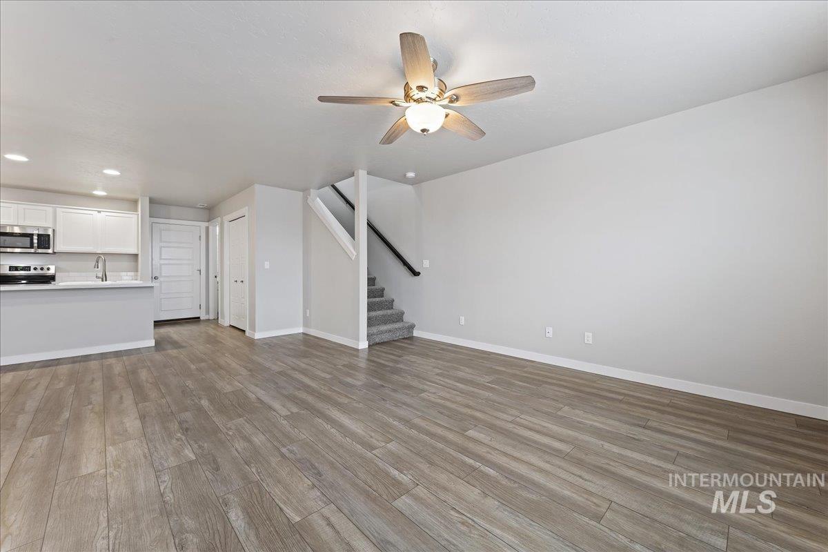 2479 East Goldstone Street Meridian, ID 83642 - Photo 6 of 29 Unfurnished living room with a ceiling fan, recessed lighting, and light wood-type flooring