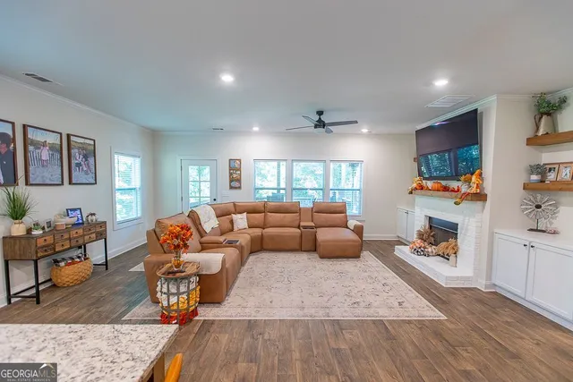 a bathroom with a granite countertop toilet sink and mirror
