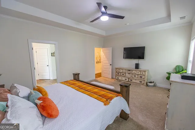 a bedroom with two beds and a window