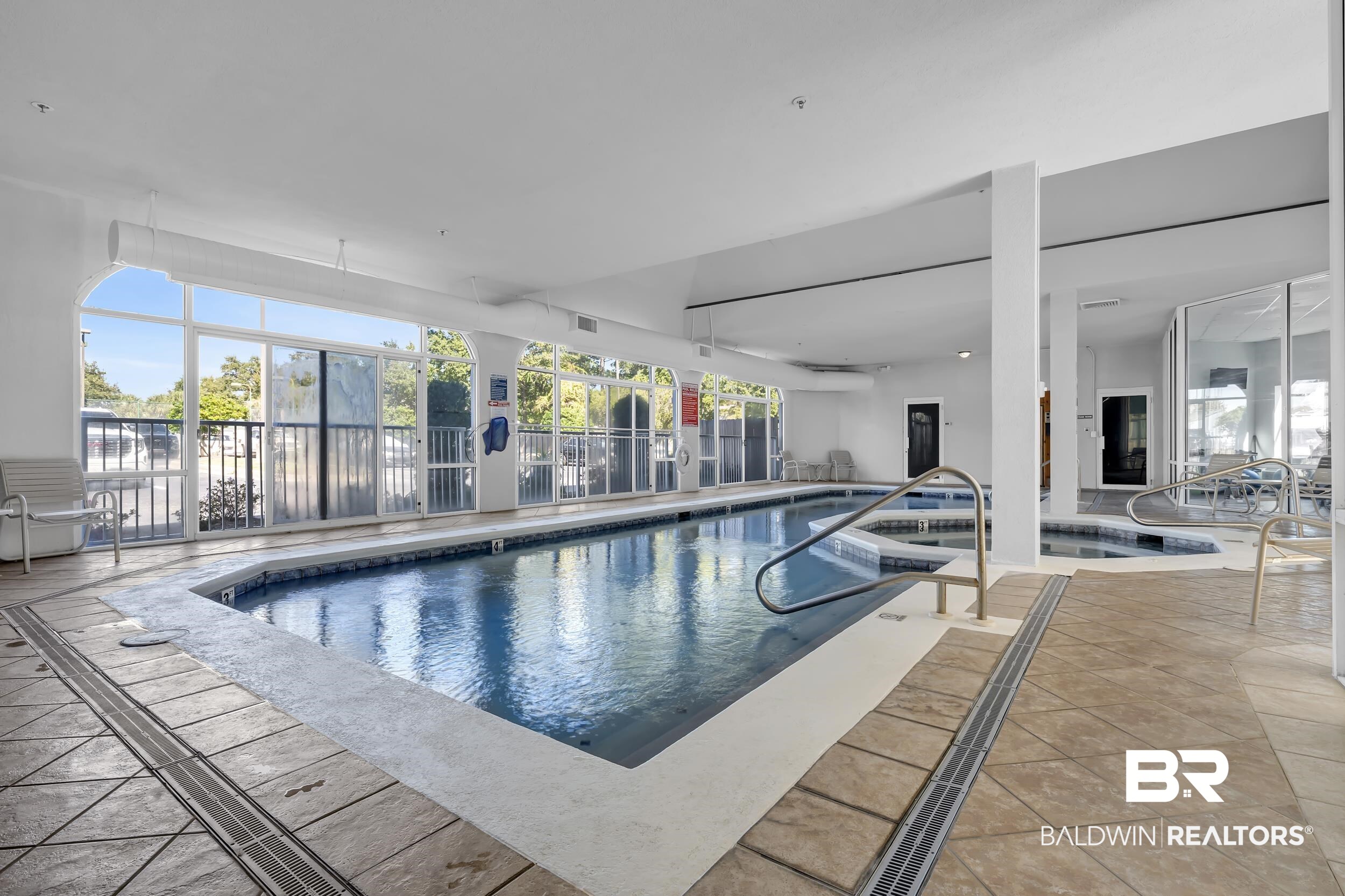 27282 Canal Road, Unit 104 Orange Beach, AL 36561 - Photo 68 of 79 Indoor pool with a sunroom