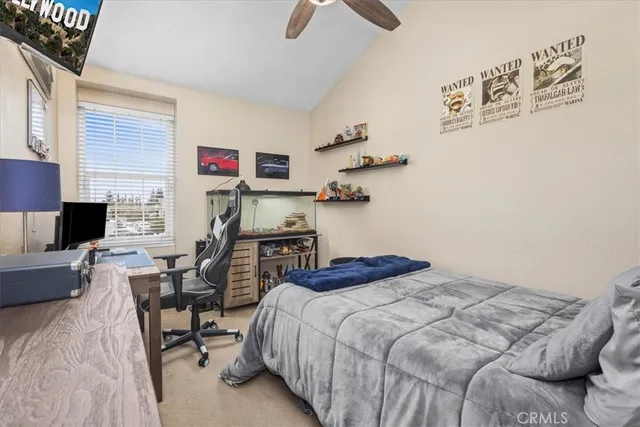 a bedroom with a bed and a couch