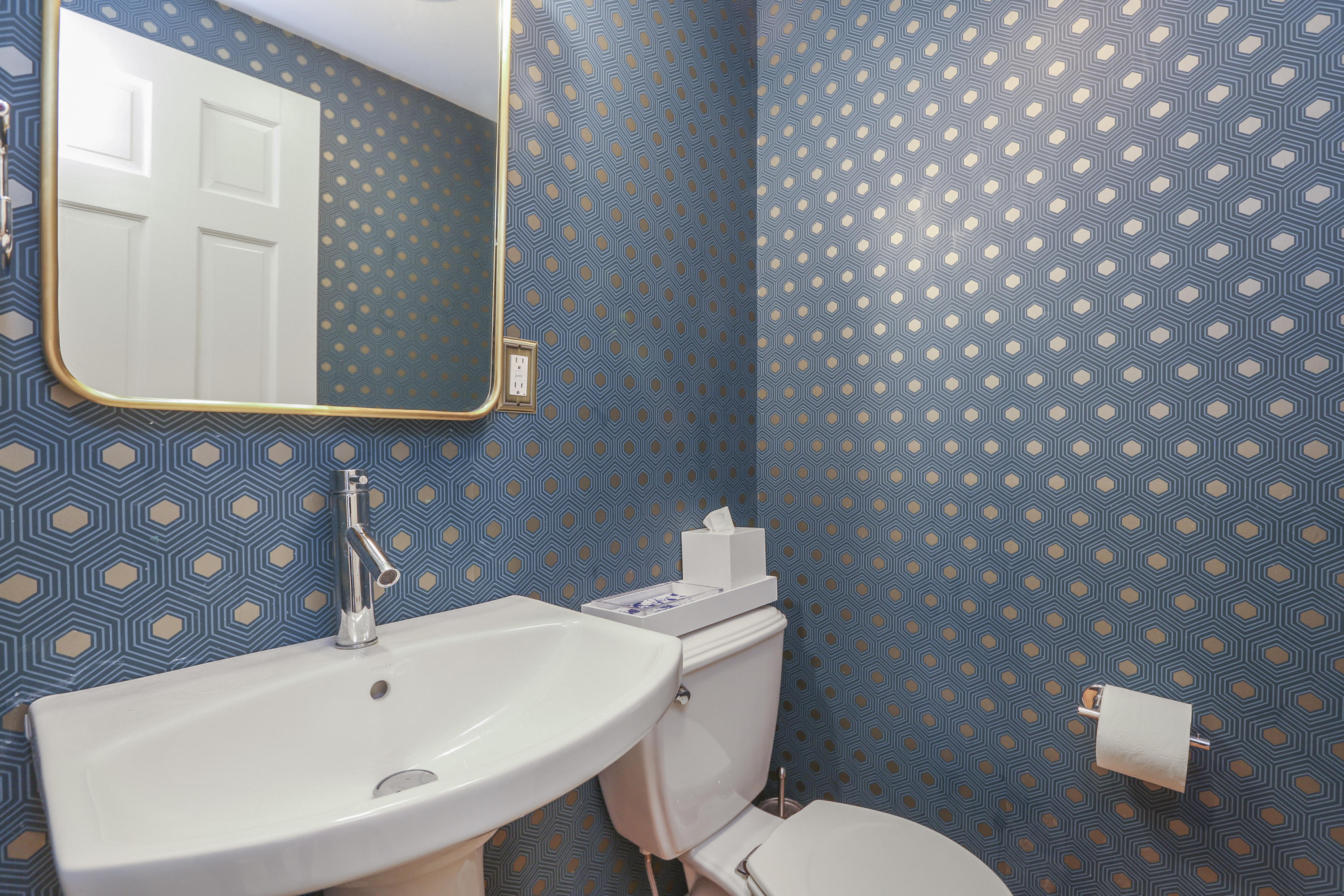 4 Colony Road Darien, CT 06820 - Photo 15 of 36 a bathroom with a sink a toilet and mirror