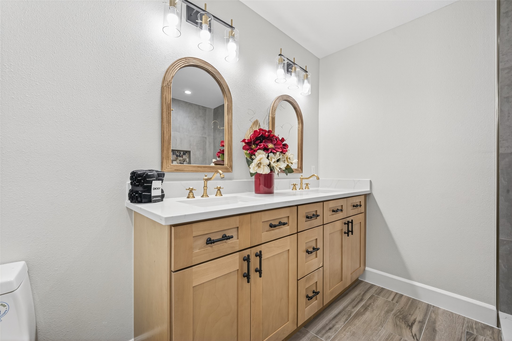 23607 Cardinal Drive Hockley, TX 77447 - Photo 24 of 50 The primary bath features a chic dual-sink vanity, providing a balanced and upscale environment for morning routines.
