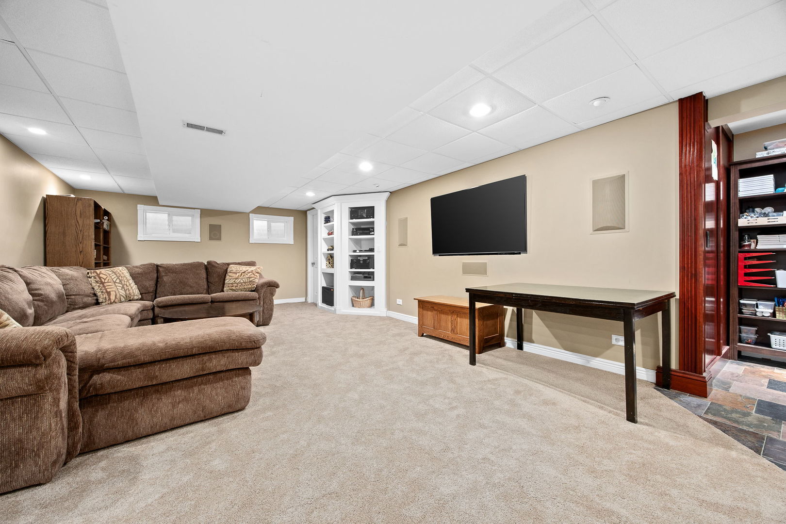 2816 Cordgrass Road Naperville, IL 60564 - Photo 30 of 49 a living room with furniture and a flat screen tv