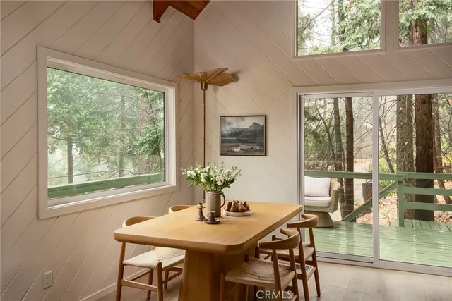 a view of a dining room with furniture window and outside view