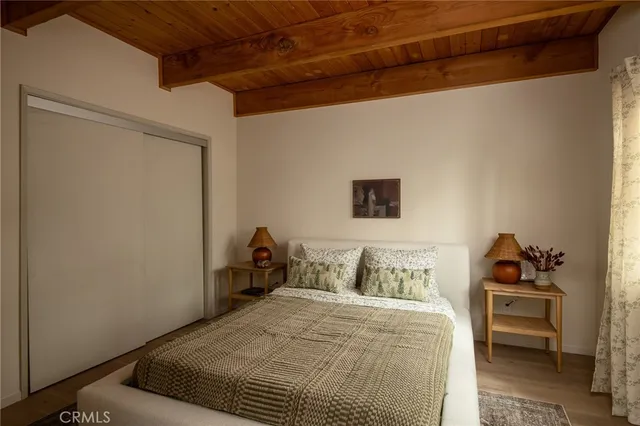 a bedroom with a bed and a dresser