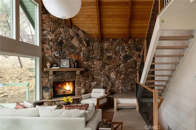 a view of a livingroom with furniture and a fireplace
