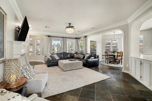 a living room with fireplace furniture and a flat screen tv