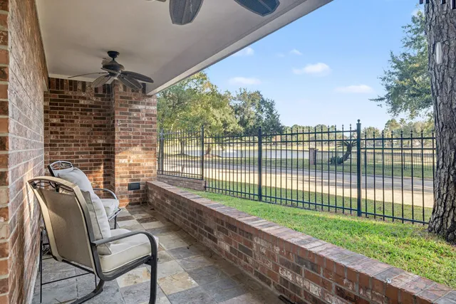 a view of a porch with furniture and backyard