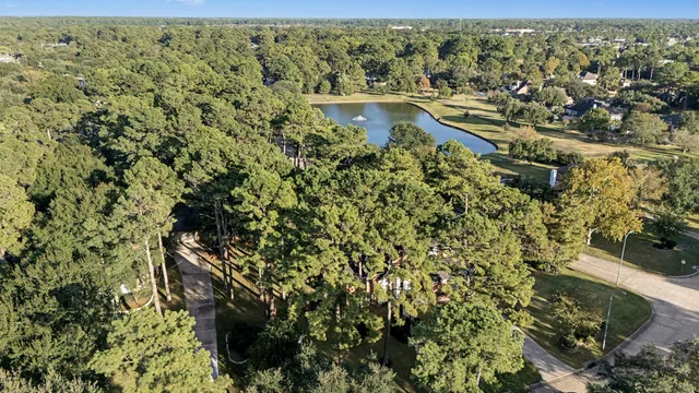 a front view of a house with a yard porch and outdoor seating
