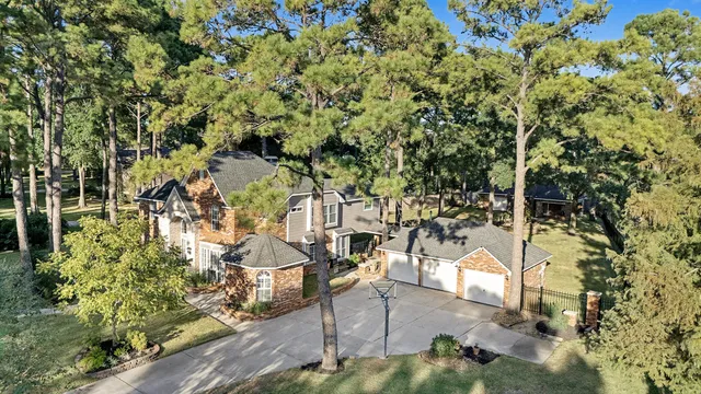 a view of a yard with wooden fence