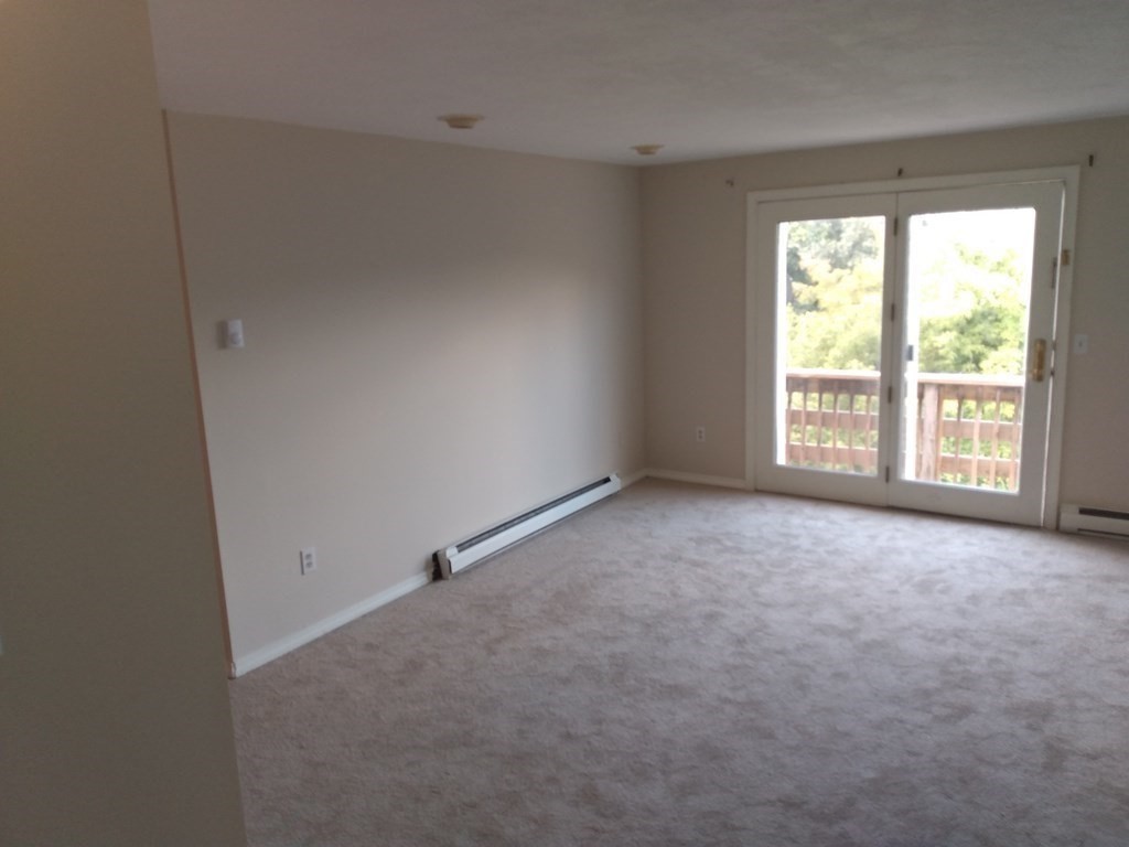 7 Gibbs Street, Unit 9 Worcester, MA 01607 - Photo 2 of 11 a view of an empty room with a window