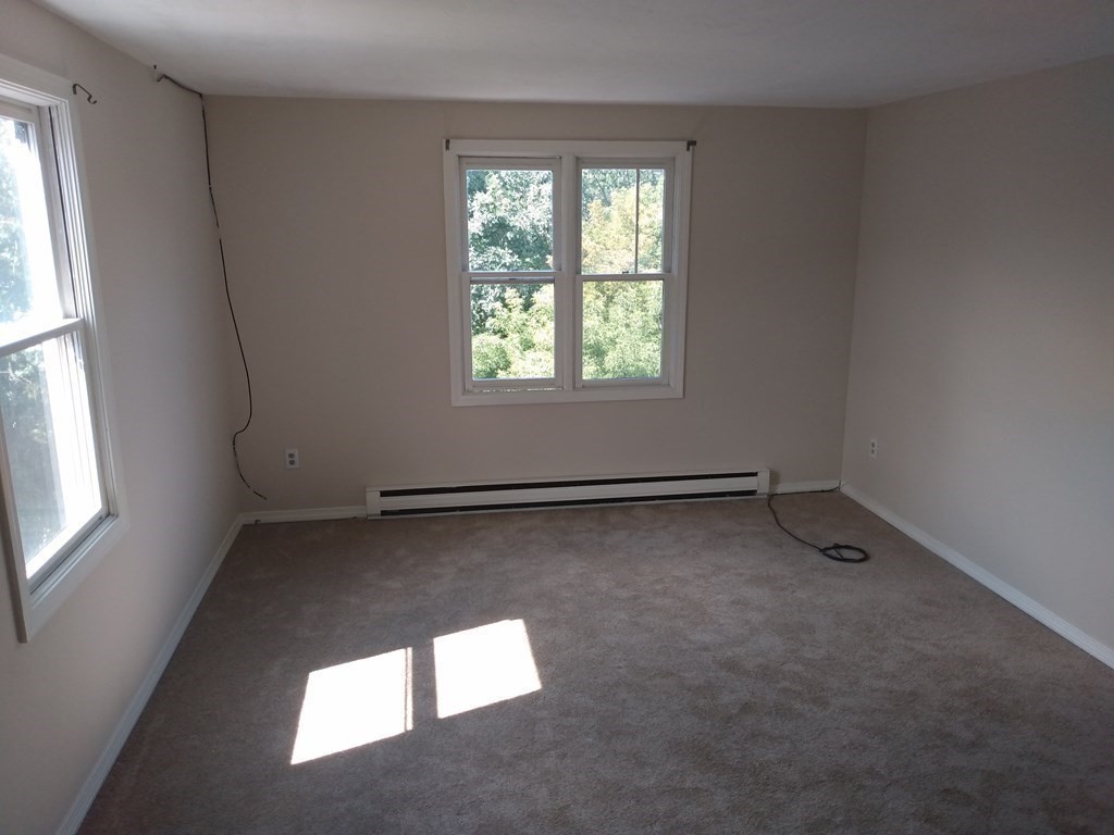 7 Gibbs Street, Unit 9 Worcester, MA 01607 - Photo 6 of 11 an empty room with a window