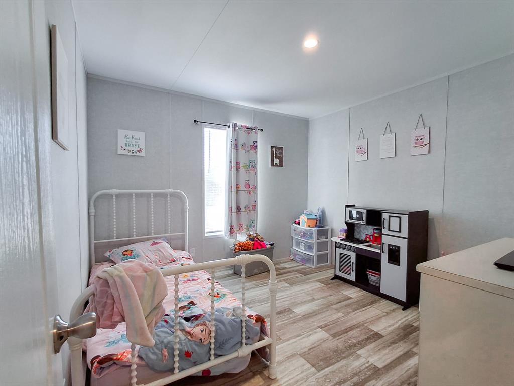 7256 Johnson Road Granbury, TX 76049 - Photo 35 of 40 Bedroom featuring light wood-type flooring