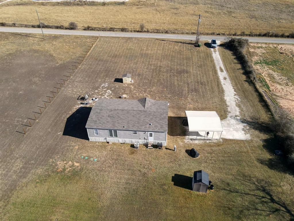 7256 Johnson Road Granbury, TX 76049 - Photo 39 of 40 Aerial view of property and surrounding area featuring rural landscape