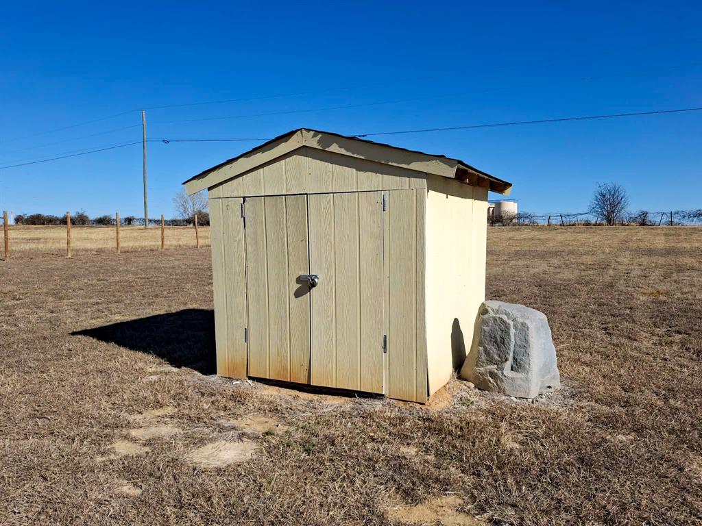 7256 Johnson Road Granbury, TX 76049 - Photo 10 of 40 View of shed featuring a view of rural / pastoral area