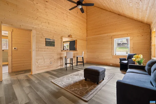 a view of a dry yard with mountains in the background