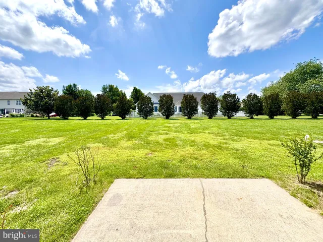 a view of an swimming pool with an outdoor space and seating area