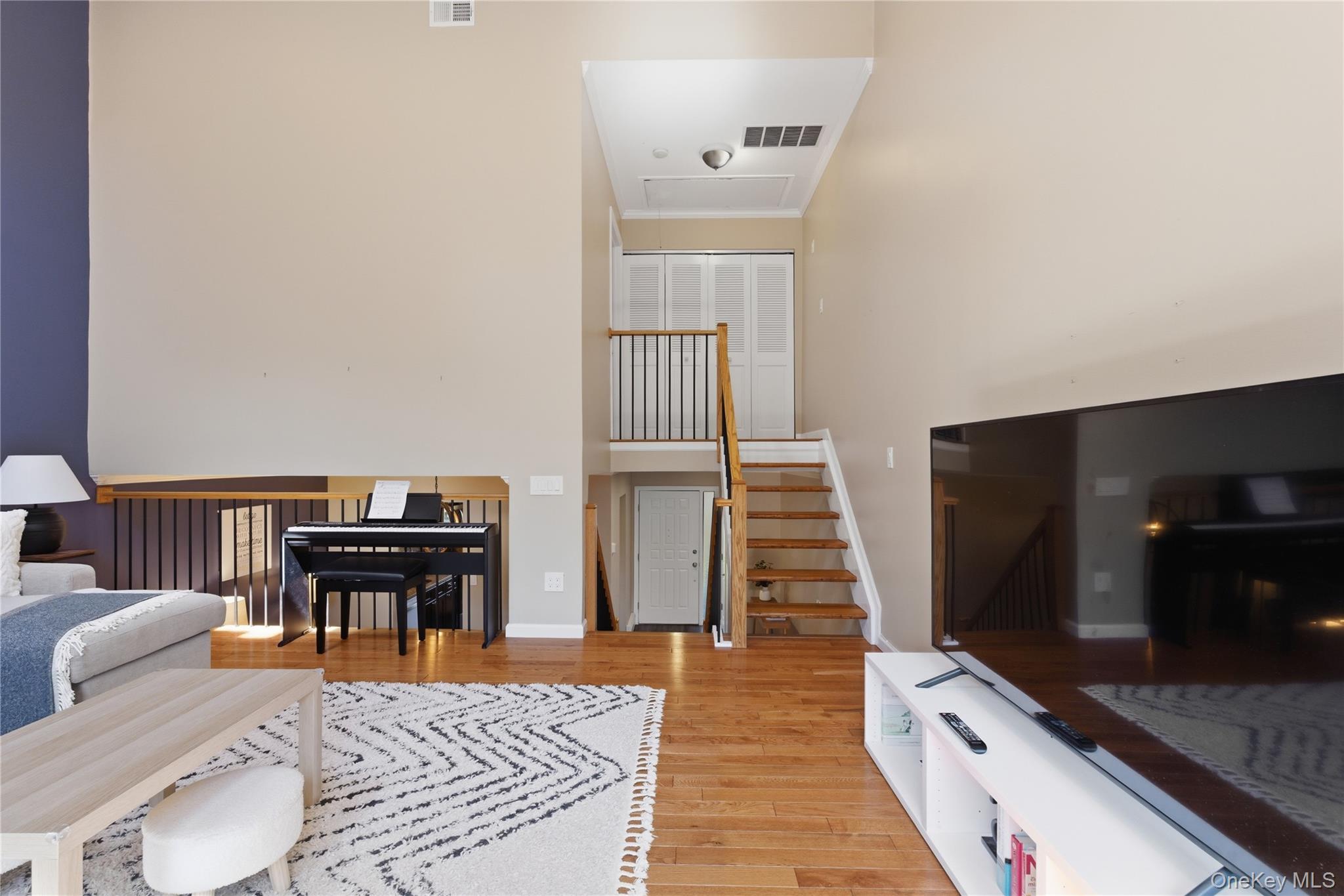 245 Tree Top Crescent Rye Brook, NY 10573 - Photo 7 of 24 a living room with furniture and a flat screen tv