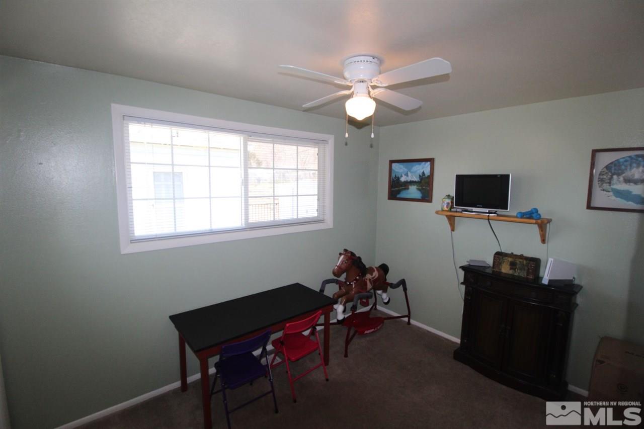 8715 Aquifer Way Reno, NV 89506 - Photo 11 of 18 a view of a workspace with furniture and a window