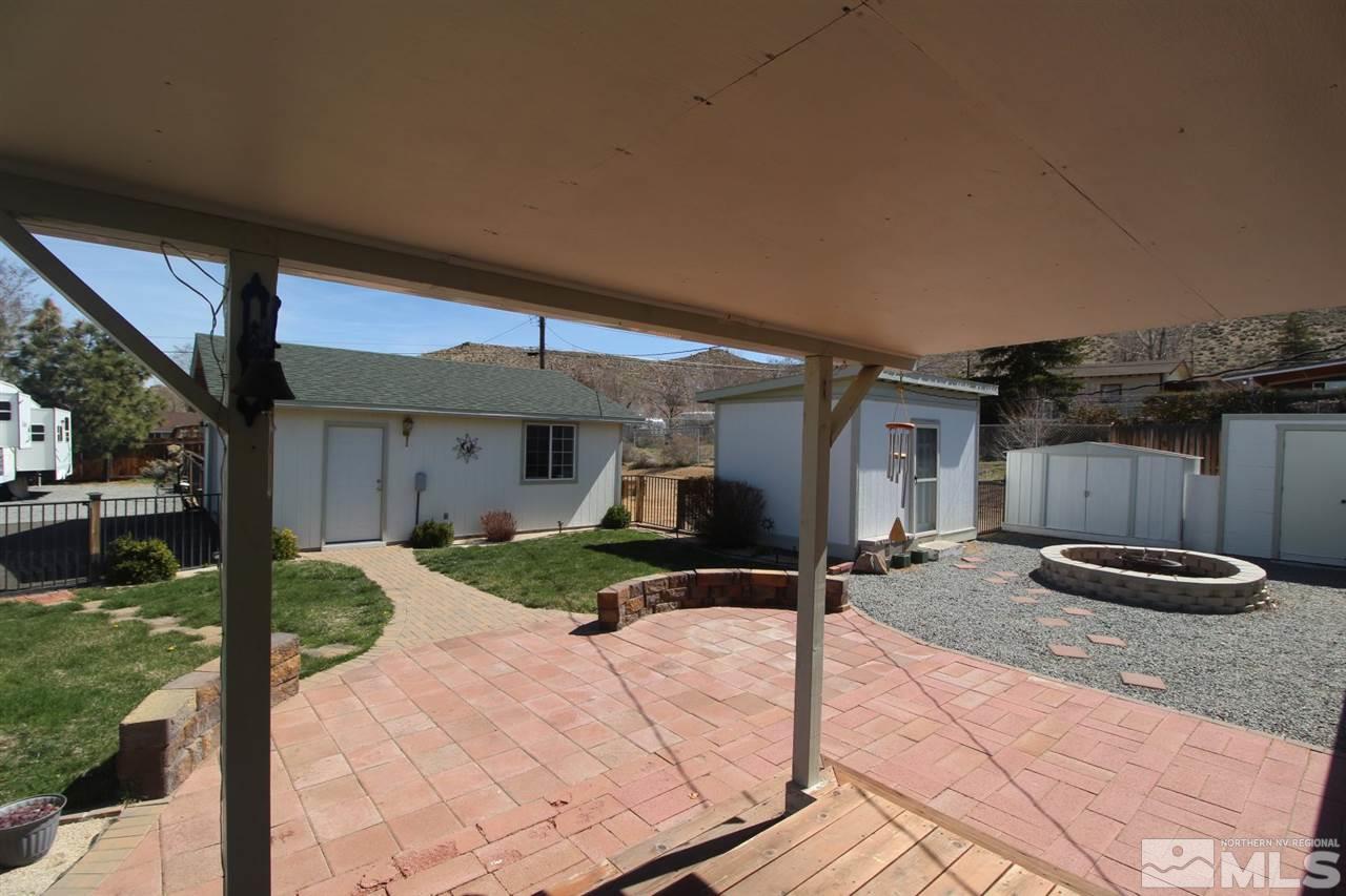 8715 Aquifer Way Reno, NV 89506 - Photo 13 of 18 a front view of a house with garden