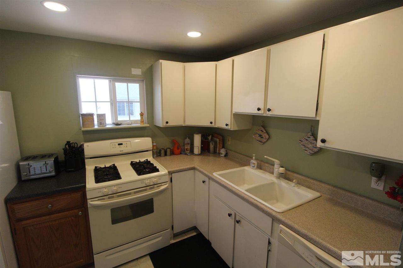 8715 Aquifer Way Reno, NV 89506 - Photo 8 of 18 a kitchen with a sink and cabinets