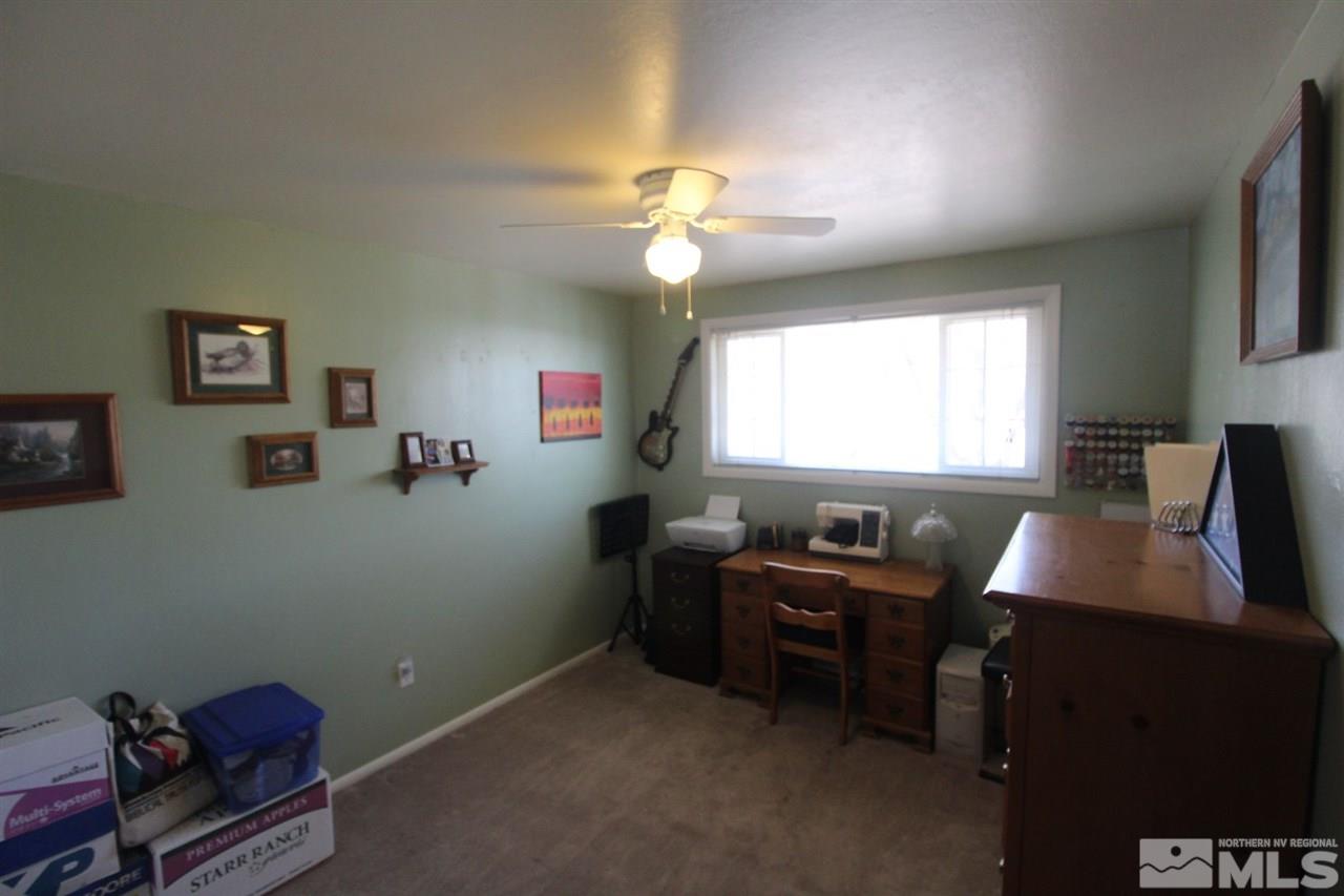 8715 Aquifer Way Reno, NV 89506 - Photo 10 of 18 a view of a workspace with furniture and a window