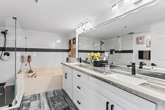 a bathroom with a glass shower door
