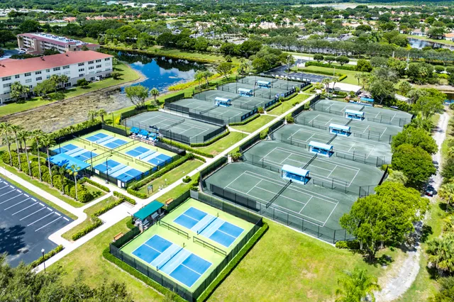 an outdoor space with lots of plants and trees