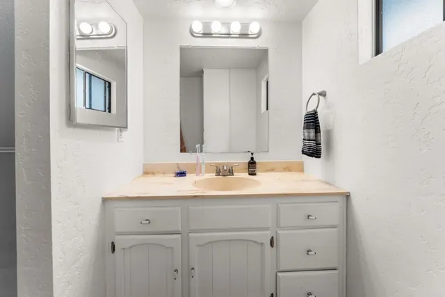 a view of a porch with a table and chairs