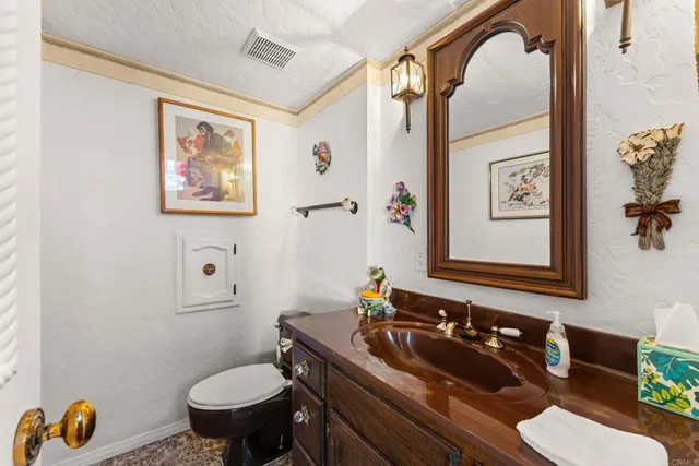 a bedroom with furniture and a flat screen tv